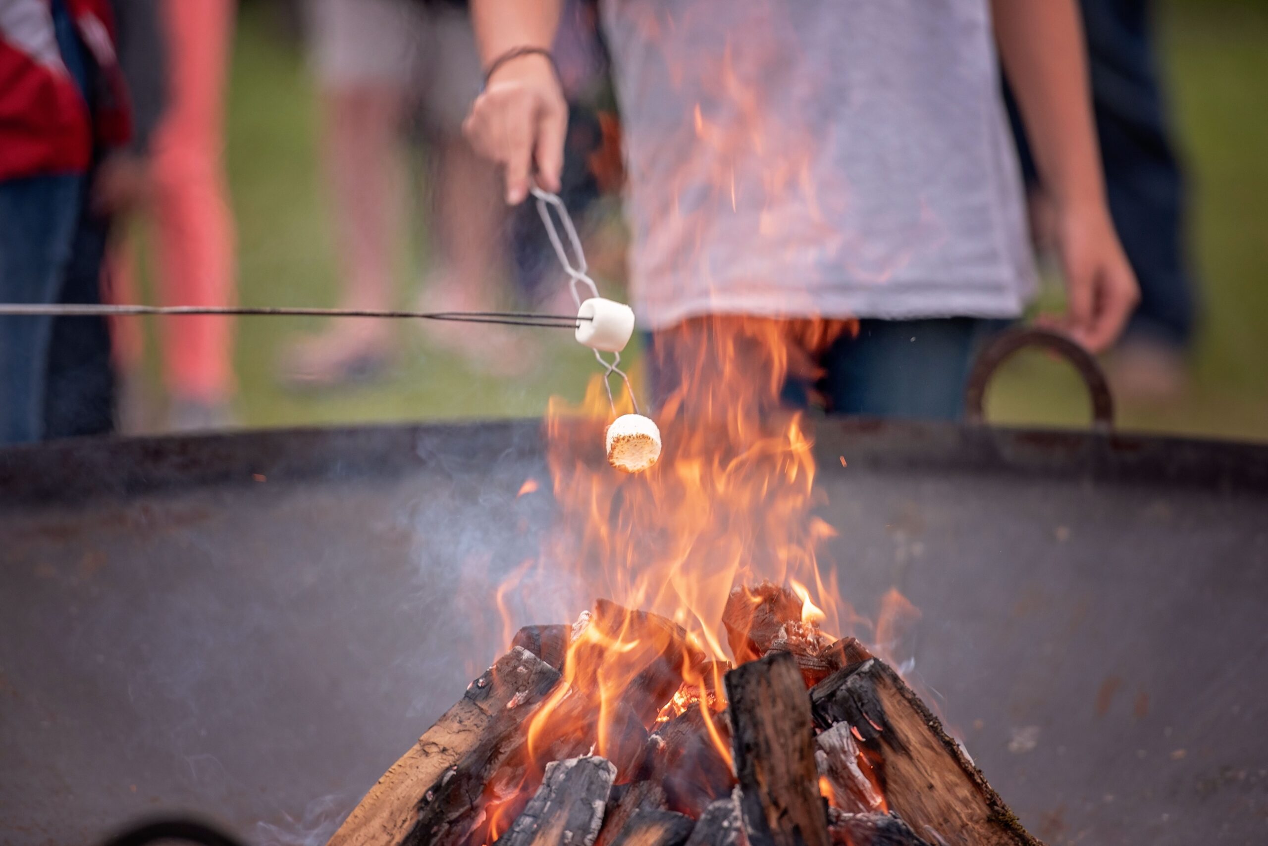 Marshmallows being roasted over a campfire.